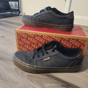 Vans dark gray low-top sneakers.